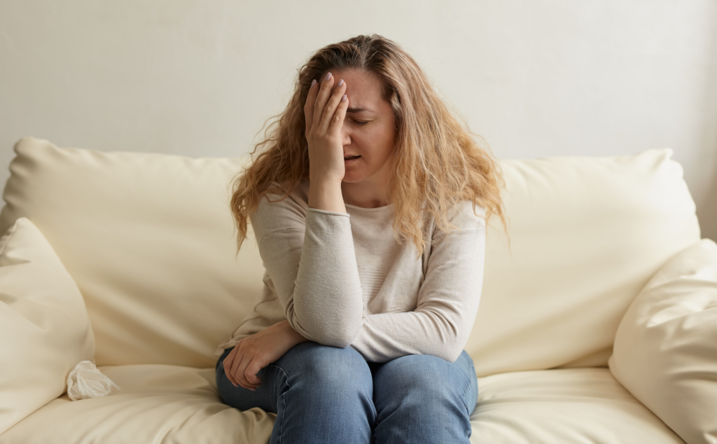 Woman sitting on sofa after quitting her job
